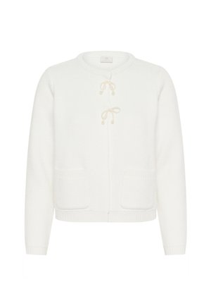 Cardigan en tricot blanc avec un col rond, doté de deux poches avant et de liens décoratifs avec des perles. Tissu texturé et doux.