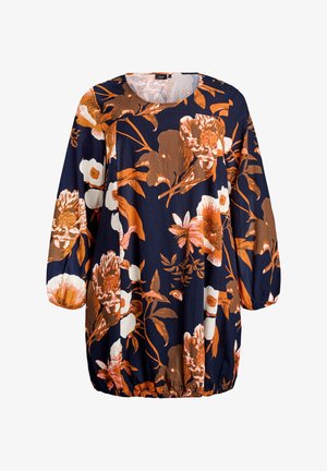 Gėlių tunika su tamsiai mėlynu fonu, didelėmis oranžinėmis ir baltomis gėlėmis, ilgomis rankovėmis ir susiraukšlėjusia juosmens linija.
