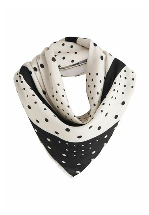 Silk scarf with a triangular shape, cream background, black polka dots, and a black border. Smooth texture with contrasting patterns.