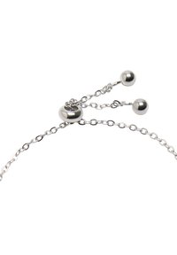 Srebrna bransoletka z delikatnym łańcuszkiem, okrągłym zapięciem i dwoma okrągłymi koralikami. Elegancki design z polerowanym wykończeniem i wyrafinowaną fakturą.