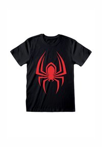 T-shirt en coton noir avec un grand graphisme d'araignée rouge au centre, mettant en avant un design angulaire avec des membres proéminents.