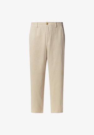 Pantaloni in corduroy beige con una texture a righe verticali, dotati di chiusura con bottone e due tasche laterali. Lunghezza croppata con vestibilità dritta.