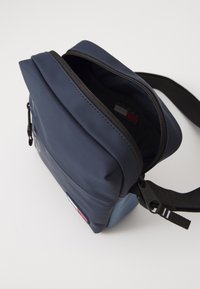 Tommy Jeans DAILY REPORTER UNISEX - Cross body bag - blue