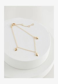 Kijelölve, gold plated sterling silver