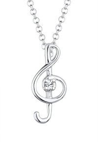 Sølv halskæde med en treble clef vedhæng, der har en lille klar ædelsten, på en fin kæde. Designet er strømlinet med glatte kurver og poleret overflade.
