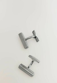 Silver metal cufflinks with a rectangular shape and a polished finish. Each features a T-bar toggle for attachment.