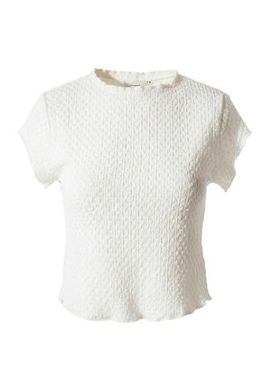 Haut blanc en maille texturée à manches courtes avec un col rond et un léger bord volanté aux manches et à l'ourlet.