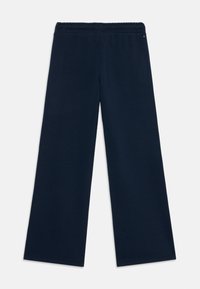Calças largas azul-marinho com uma cintura elástica texturizada, apresentando um acabamento suave e sem padrões ou acentos adicionais.