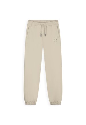 Beige joggingbroek met een elastische taille en boorden, een trekkoord, twee zijzakken en een klein rond logo op de linker dij.