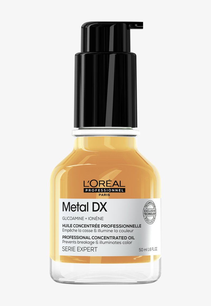 Flacon d'huile concentrée professionnelle L'Oréal Professionnel Metal DX avec pompe, 50 ml, pour prévenir la casse et illuminer la couleur des cheveux.
