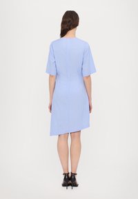 Blue and white striped dress with short sleeves, slightly asymmetrical hemline, and a keyhole back closure. Smooth fabric texture.