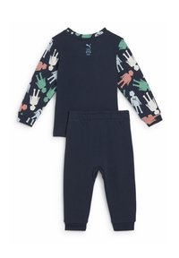 Set di pigiama in due pezzi di colore blu marina, composto da una maglietta a maniche lunghe con figure di cartoni animati colorate sulle maniche e pantaloni abbinati con cintura elastica.