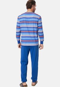 Men's loungewear set featuring a long-sleeve blue striped top with red and white accents, paired with solid blue pants.
