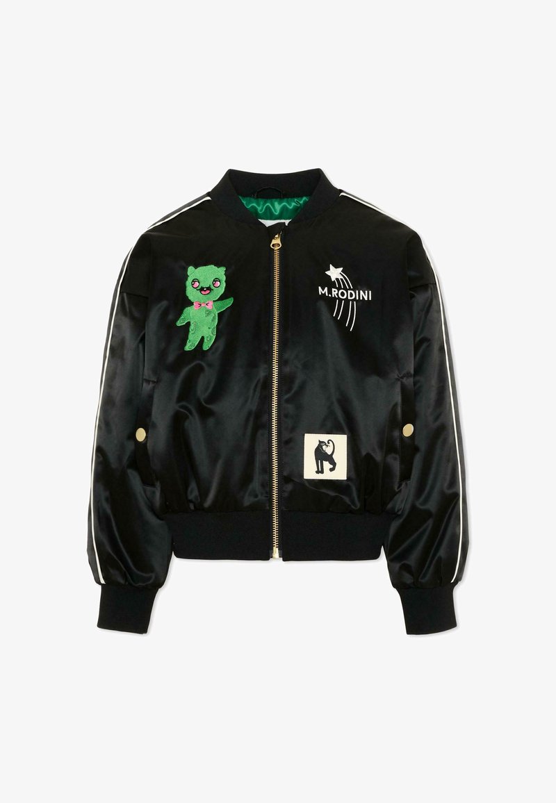 Chaqueta bomber de satén negro con parche de oso verde, estrella fugaz blanca con texto "M.RODINI" y un parche pequeño de gato negro en el frente.