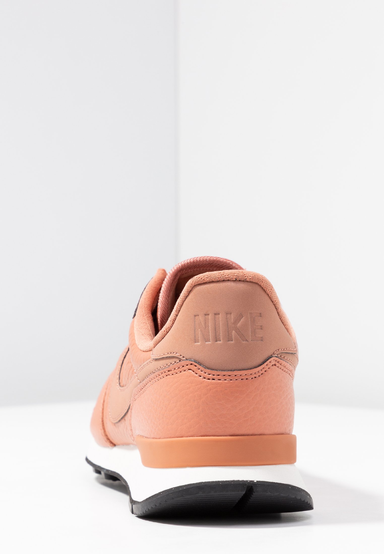 blush nike trainers