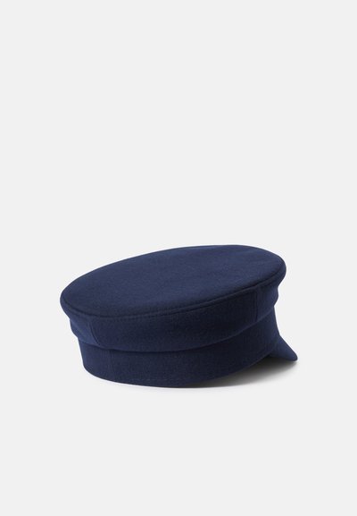 Gorro de lã azul-marinho com um topo arredondado e visor curto. Apresenta um design estruturado e uma textura suave, adequado para o tempo mais fresco.