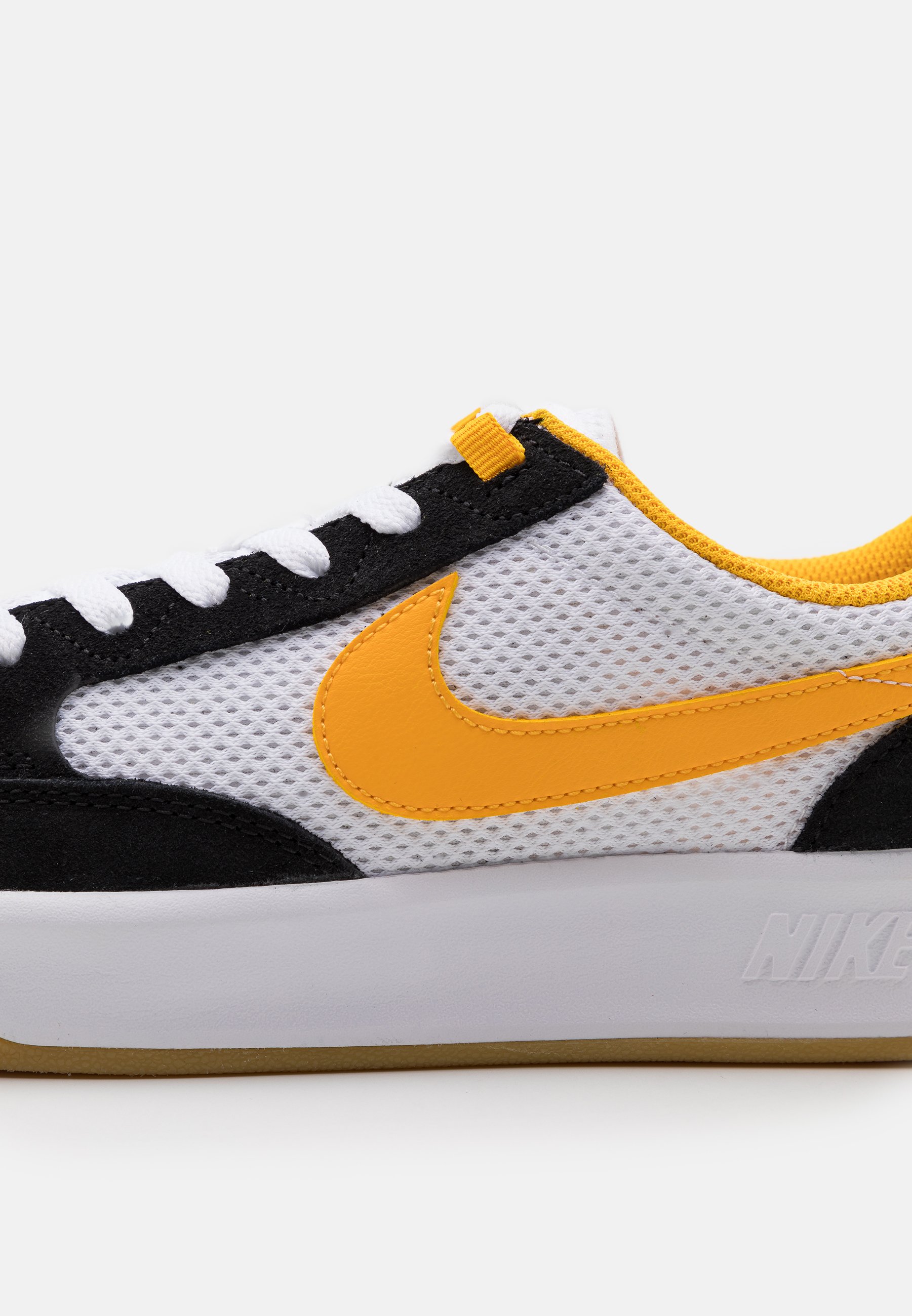 nike skate shoes black and gold