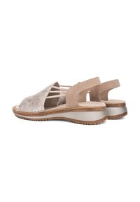 Open-toe sandals with a geometric patterned silver upper and beige suede accents, featuring a textured wedged sole for grip.