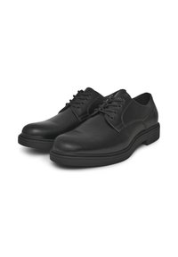 Scarpe in pelle nera con punta arrotondata e dettagli cuciti. Presentano un design con lacci e una suola piatta in gomma per una buona aderenza.