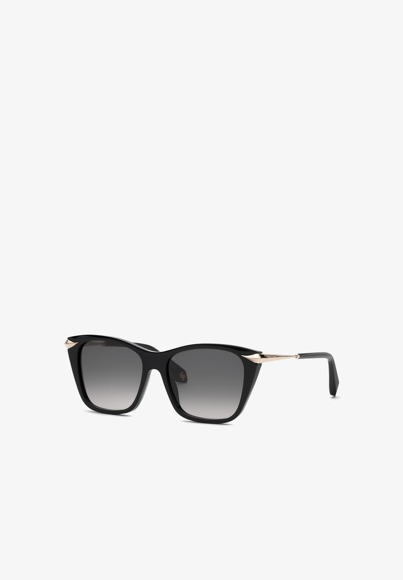 Lunettes de soleil noires à monture carrée avec verres dégradés foncés et fines branches métalliques dorées sur fond blanc.