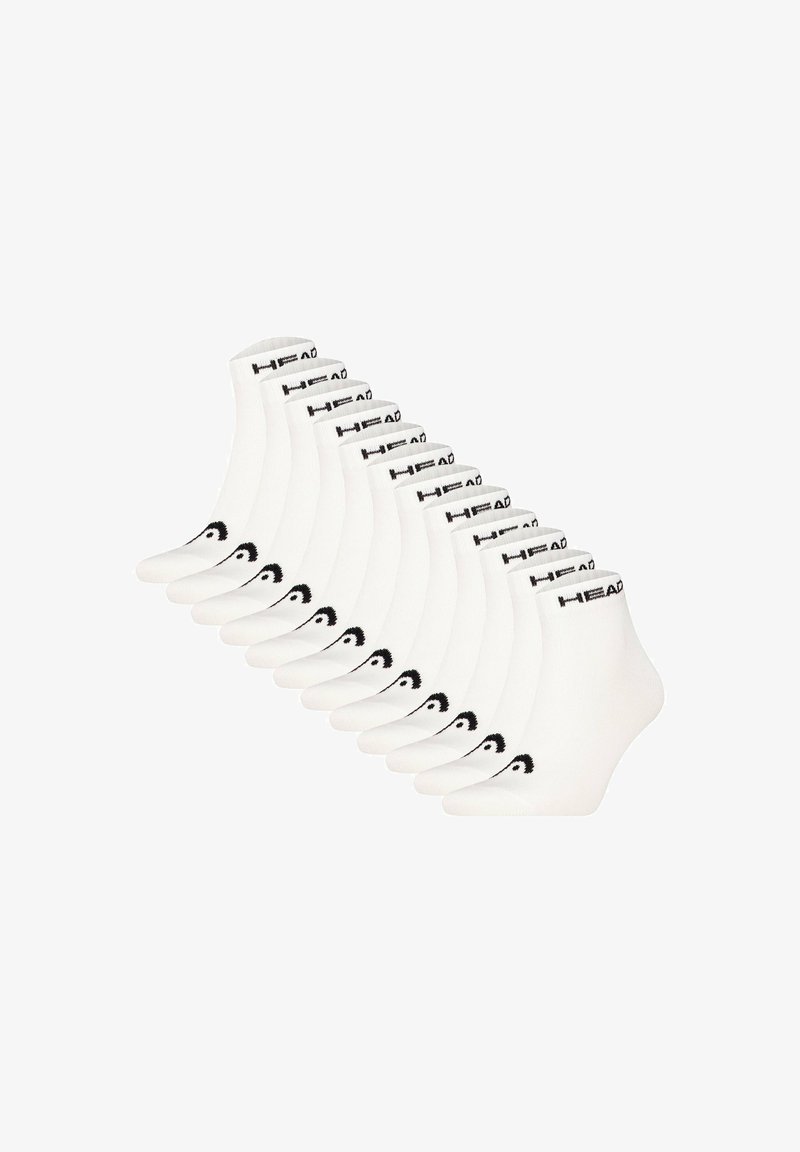 Chaussettes blanches de cheville avec une bande de logo noire et des accents graphiques courbés. Vendues par pack de dix, fabriquées en matériau doux et extensible.
