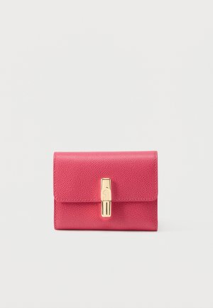Compact pink leather wallet with textured surface and gold-tone clasp closure, set against a plain light background.