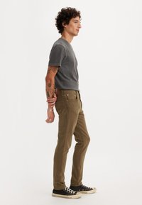 Levi's® 512™ SLIM TAPER - Slim fit jeans - forest foliage gd