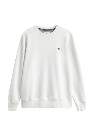 Weißes Langarm-Sweatshirt mit Rundhalsausschnitt, gerippten Bündchen und Saum, mit kleinem rot-weiß-blauem Schild-Logo auf der linken Brust.