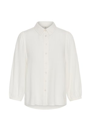 Valkoinen pitkähiha pusero, jossa napillinen etuosa, terävä kaulus ja kevyestä kankaasta valmistetut hieman kerätyt hihansuut.