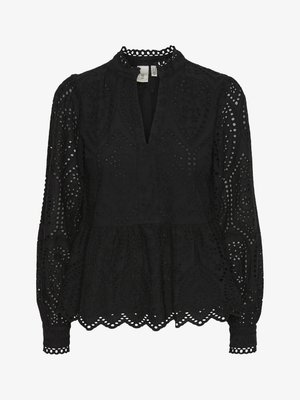 Črna bluzica z visokim ovratnikom, dolgimi rokavi in zapletenimi izrezi, s peplum robom in valovitimi robovi.