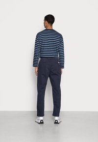 Levi's® XX CHINO EZ TAPER II - Hlače - navy