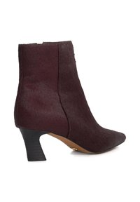 Burgundy ankle boot made of textured hair-like material, with a pointed toe and a low, angled black heel. Side zip closure visible.