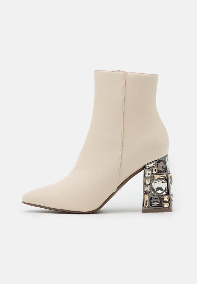 High heeled ankle boots - white
