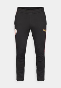  Sorte sweatpants med røde side accenter, med et hvidt logo-patch og et gult Puma-logo. Fremstillet af blødt, strækbart stof.