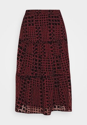 Falda negra de longitud media con patrones geométricos rojos, con diseño en capas y cintura elástica para un ajuste y comodidad ajustables.