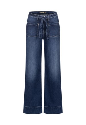 Dark blue wide-leg jeans with large front patch pockets and a matching fabric belt tied at the waist.