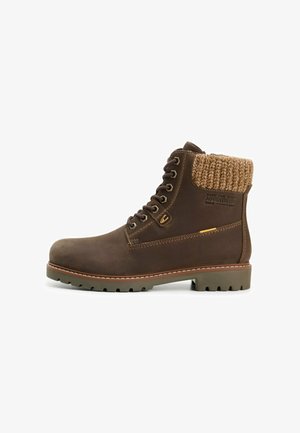 Brown leather ankle boot with a knitted tan collar, featuring metal eyelets, stitched accents, and a textured rubber sole.