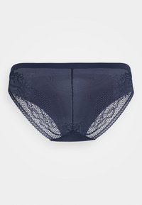 Marineblå truser med blonder bak, som har et mesh-lag og blomsterblonde-detaljer. myk elastisk midje og detaljerte blondekanter.