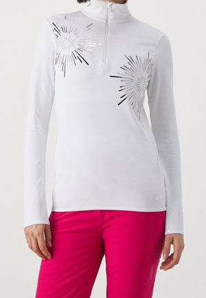 Long-sleeve white top with quarter zipper and silver starburst designs paired with bright pink pants, shown from shoulders to hips.