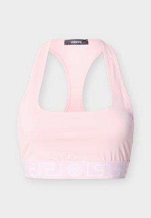 Light pink Versace sports bra with racerback design and branded elastic band featuring Greek key pattern and Medusa logo.