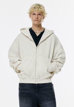 Tröja med dragkedja - white