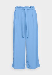 Ljust blå vida byxor med en veckad front, en knytmidja och en mjuk, slät textur. Nederkanten är fint och skräddarsytt avslutad.