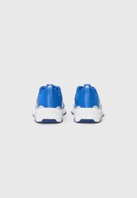 Blue training shoes with white accents, mesh upper, and rubber sole, featuring a textured design and pull tabs on the heel for easy wear.