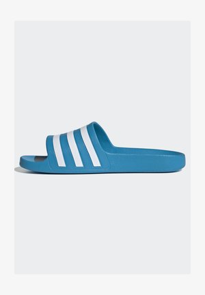 Blue slide sandal with three white horizontal stripes on the band, featuring a textured sole and smooth upper material.
