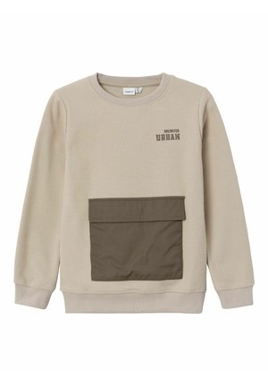 Beige, strukturierter Pullover mit Rundhalsausschnitt, ausgestattet mit einer braunen Fronttasche und dem Schriftzug "UNLIMITED URBAN" in Dunkelgrau. Weicher Stoff.