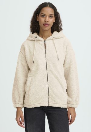 Beige fleece hoodie med dragkedja framtill, framfickor, justerbar dragsko på huven och ribbade muddarna, med ett strukturerat, mjukt tyg.