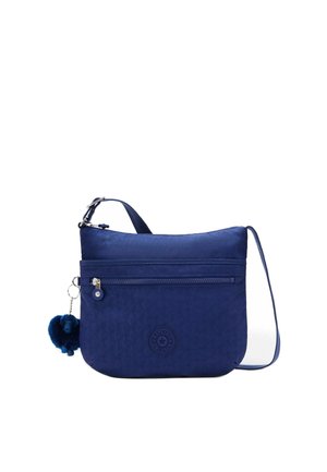 Blue crossbody bag with front zipper pocket, adjustable strap, and small blue plush keychain attached to zipper pull.