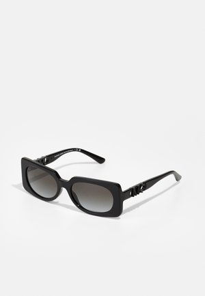 Black sunglasses with a square frame, gradient lenses, and decorative hardware on the temples. Made of glossy plastic.