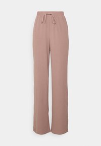 Pantalons amples rose clair en tissu doux, dotés d'une taille élastique avec cordon de serrage et de jambes larges.