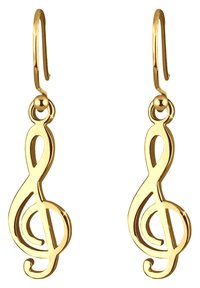 Boucles d'oreilles en ton doré en forme de clé de sol avec une finition lisse et un design délicat de crochet, présentant des courbes élaborées et un aspect poli.